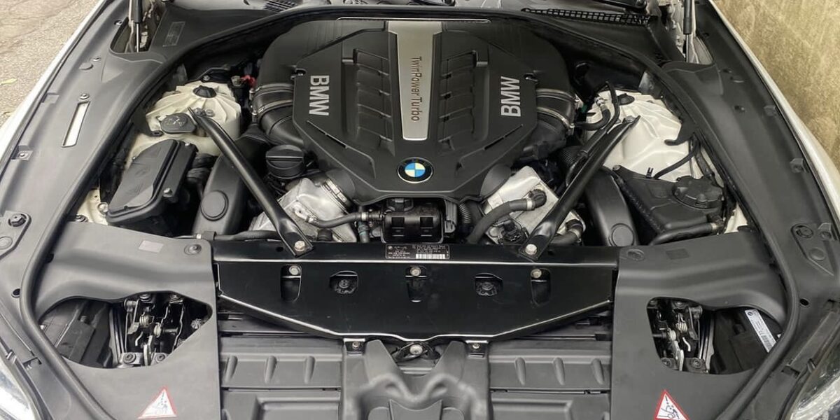 Clean, dressed engine bay after detailing