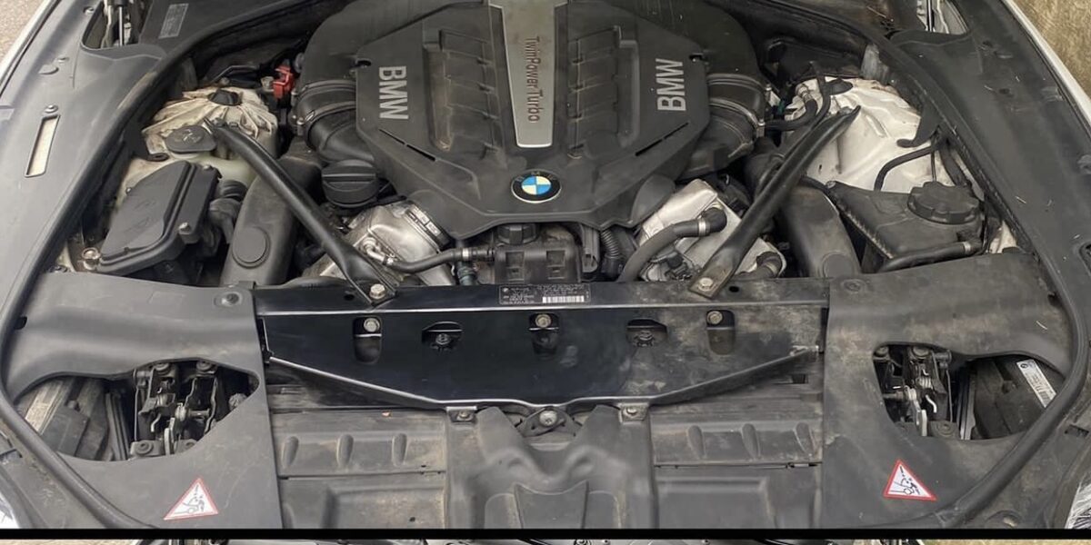 Dusty engine bay before degreasing