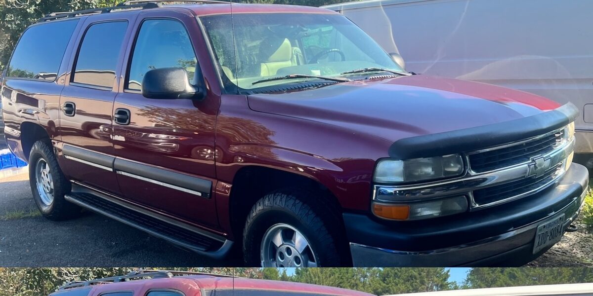 Dusty red SUV before an exterior wash