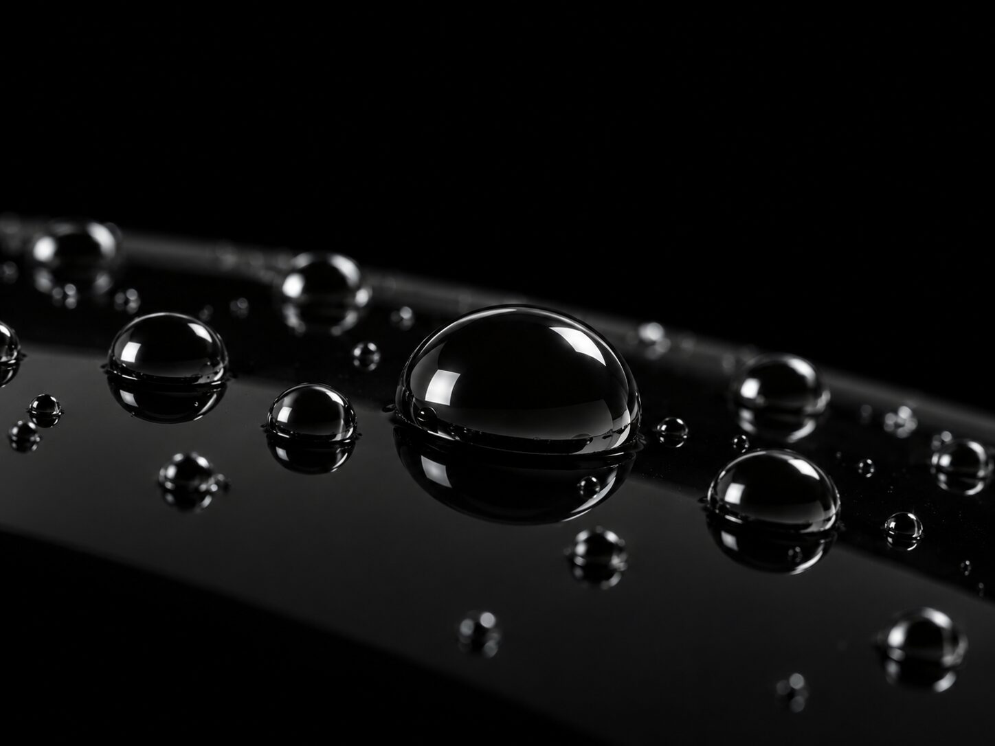 Water beading on black ceramic-coated paint