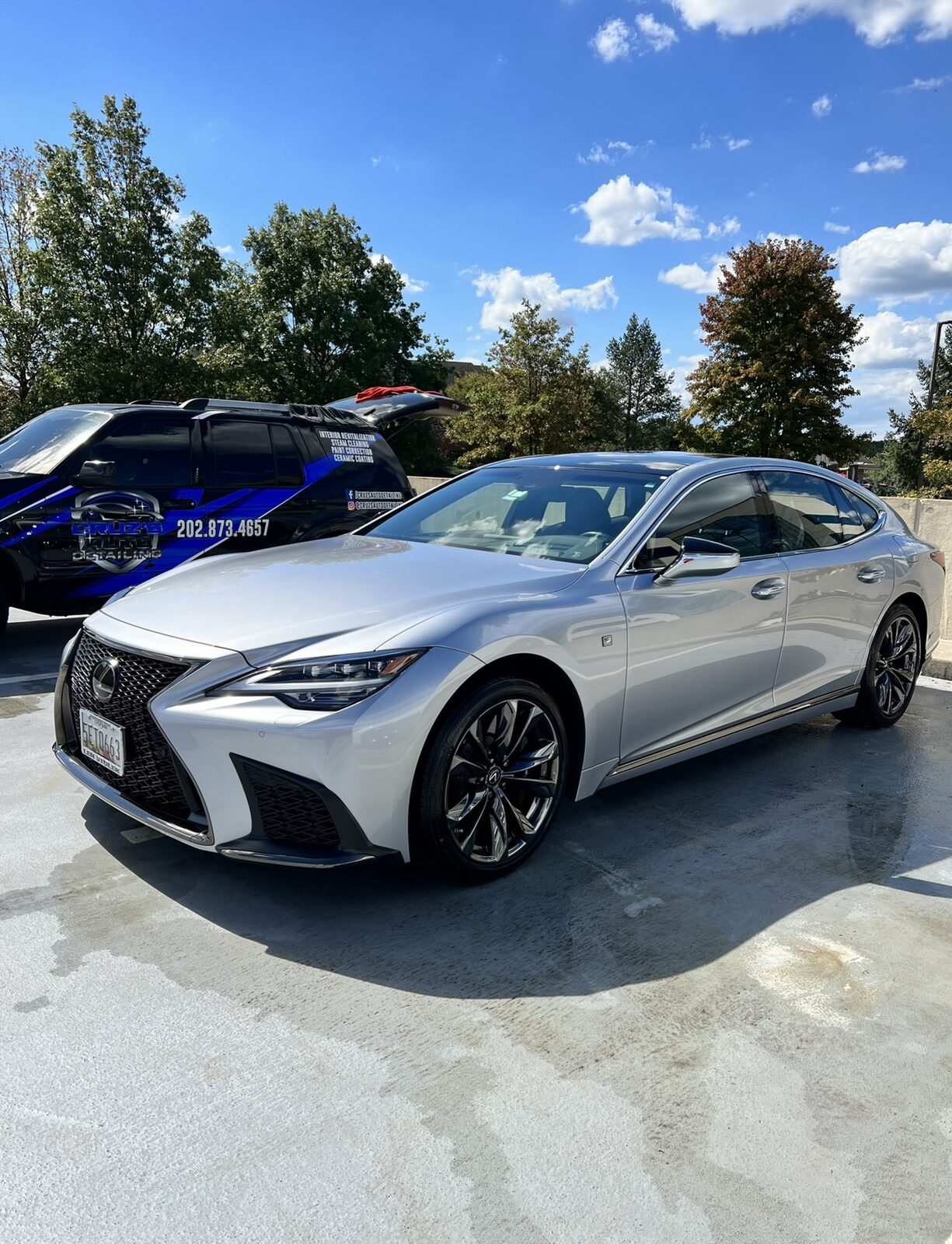 Silver Lexus with water beading during wash