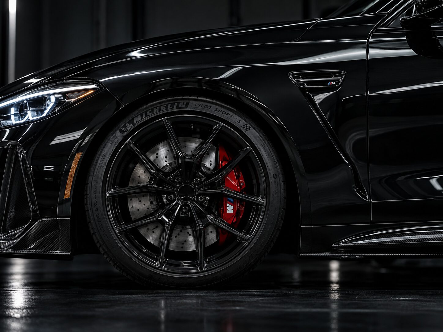 Blacked-out sports car fender and wheel